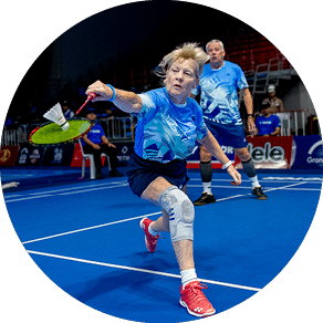A woman in a blue shirt is playing frisbee on a tennis court. AI generated content
