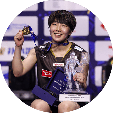 A woman is holding a trophy and a medal. AI generated content