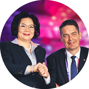 A man and a woman shake hands in front of a pink background. AI generated content