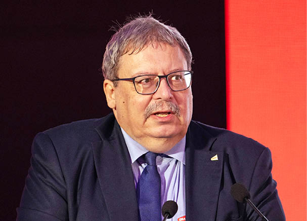 A man in a suit and tie is giving a speech at a podium. AI generated content