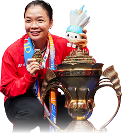 A woman in a red jacket is holding a trophy and a gold medal. AI generated content