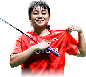 A woman wearing a red shirt and holding a tennis racket. AI generated content