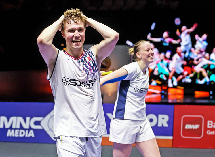 Two people are playing a game of tennis, both holding tennis rackets. They are both smiling and enjoying the game. AI generated content