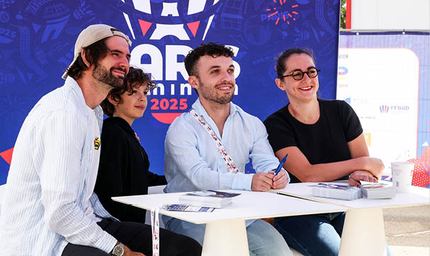 A group of people are sitting around a table, smiling and posing for a picture. AI generated content