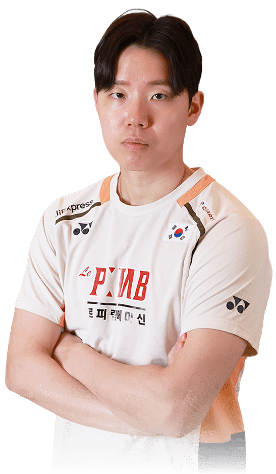 A man wearing a white shirt with red letters and an orange stripe stands with his arms crossed. AI generated content