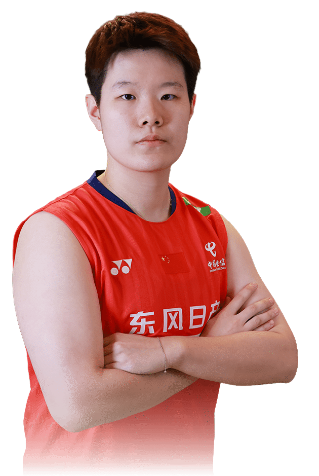 A woman wearing a red shirt and holding her arms crossed. AI generated content