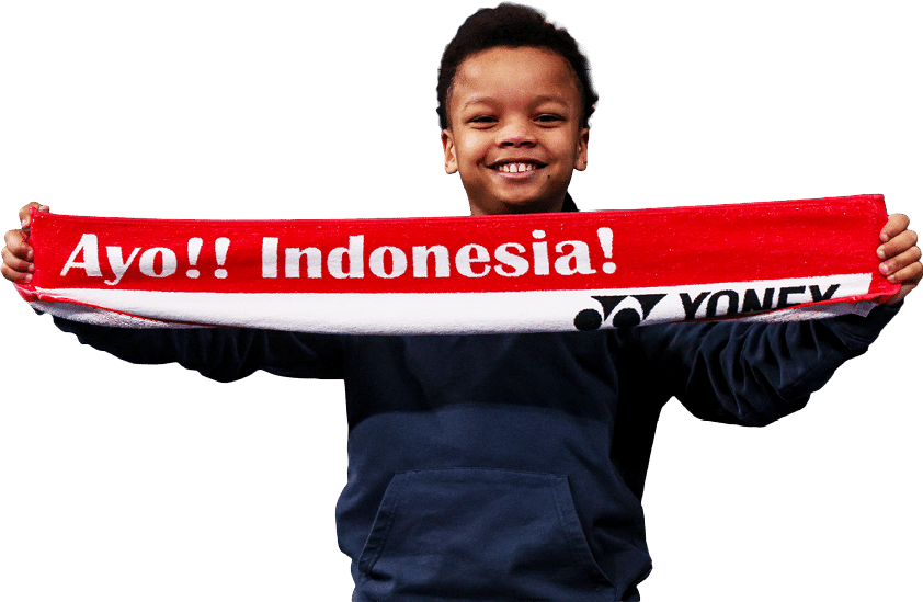 A young boy is holding a red and white scarf with the words “Ayo! Indonesia!" written on it. AI generated content