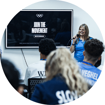 Two women are speaking at a podium in front of a group of people. AI generated content