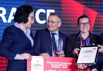 A woman is holding a certificate while standing next to three other people. AI generated content