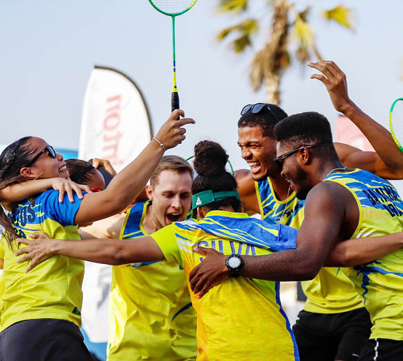 A group of people are hugging each other while holding a green object. AI generated content